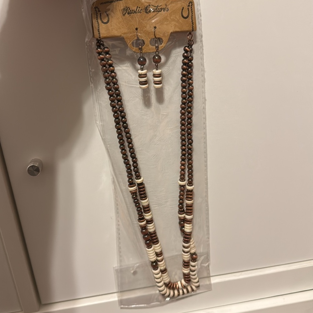 Unopened Rustic Coutures matching necklace and earring set.